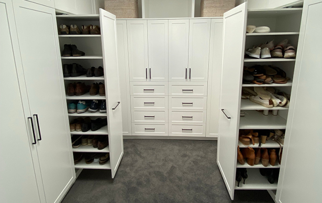 Custom walk in wardrobe featuring Janper Duraform Loddon profile cabinetry and Hettich hardware