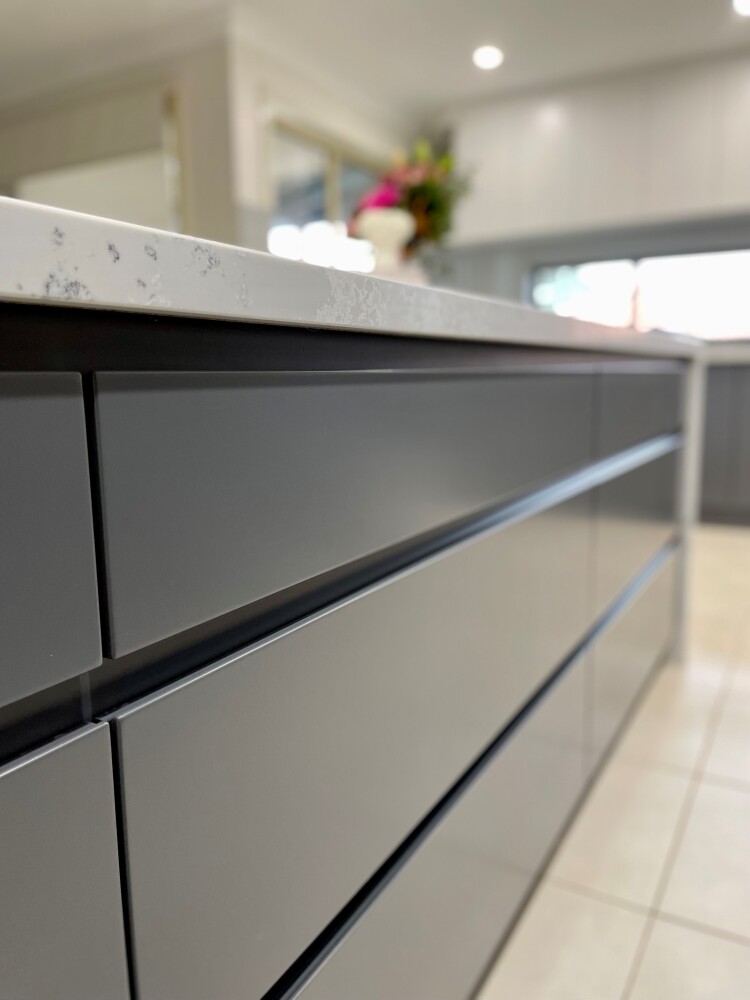 alt="It's all in the details with Janper doors and drawers combined with WK Quantum Quartz Monte Bianco in this beautiful kitchen renovation in Lilydale, Victoria."